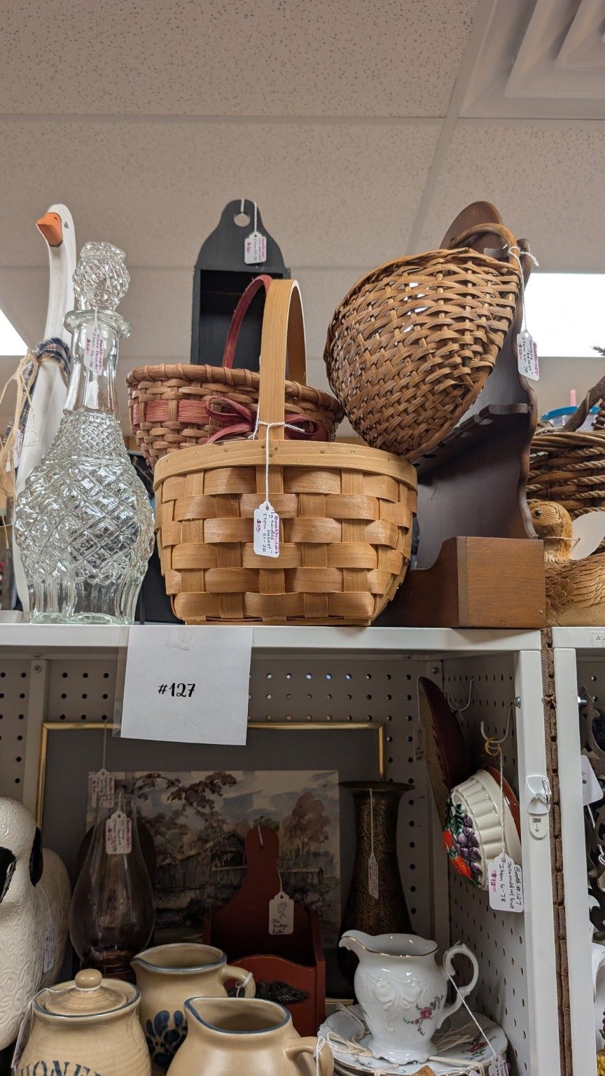 Quality Consignments booth 127 display